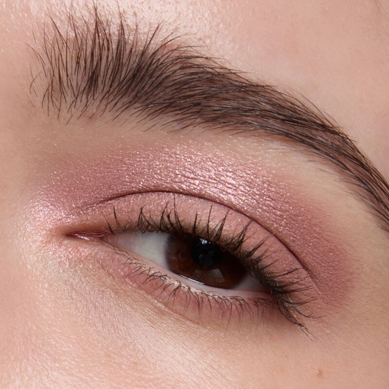 Light skinned model wearing Mary kay Eye Shadow Sticks in shades Pink Prisms and Lunar Rose